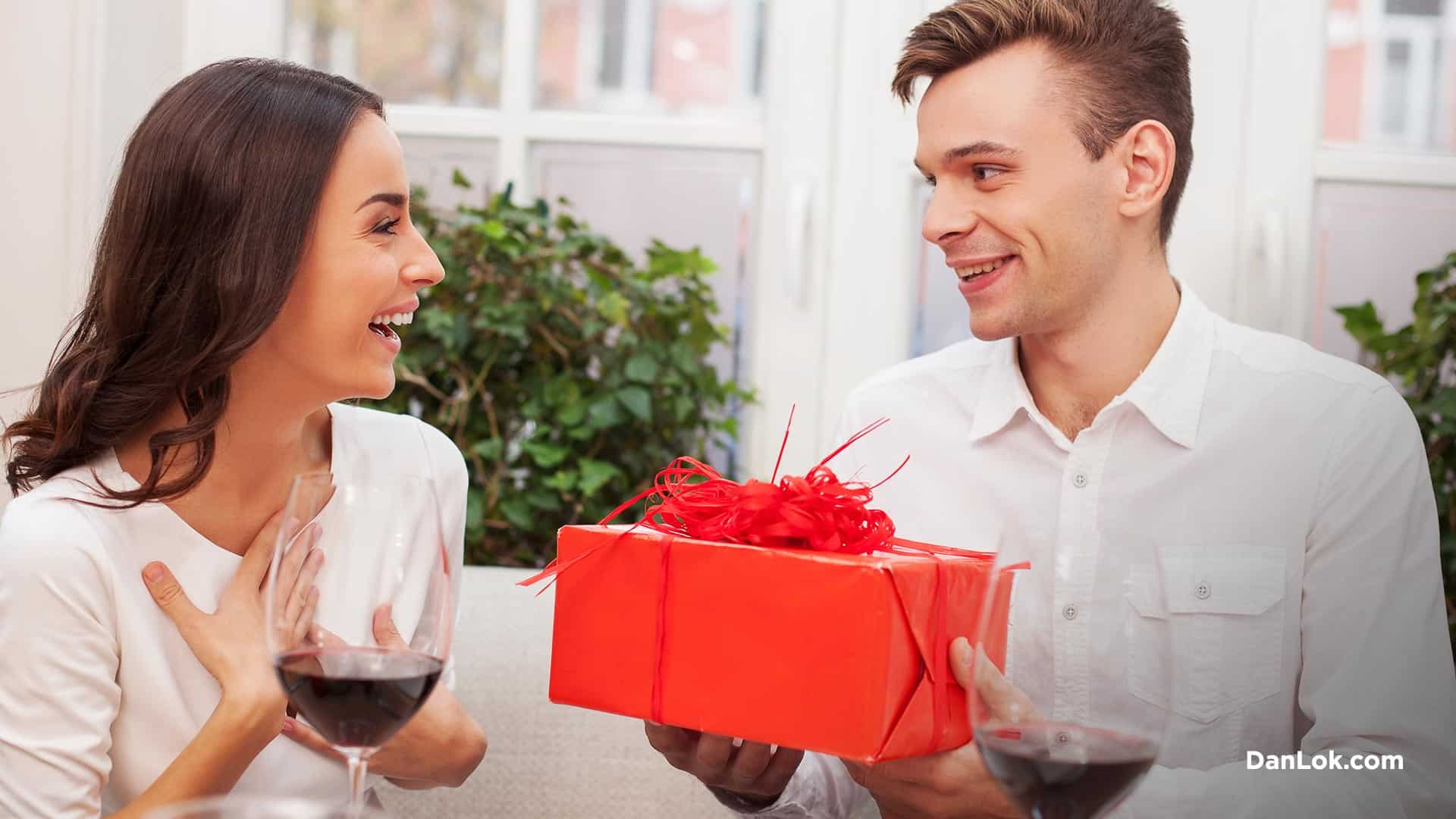 Man giving his wife a present