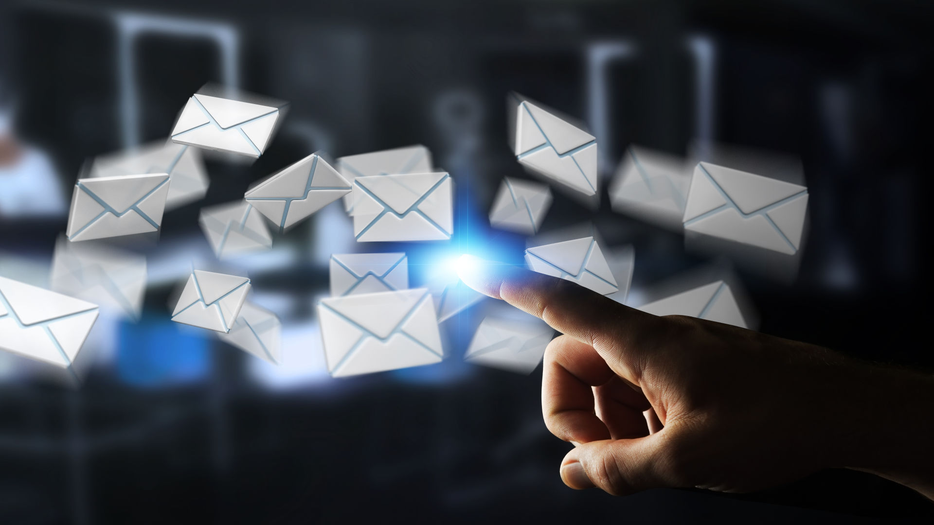 A image shows a hand is pointing emails in the air.